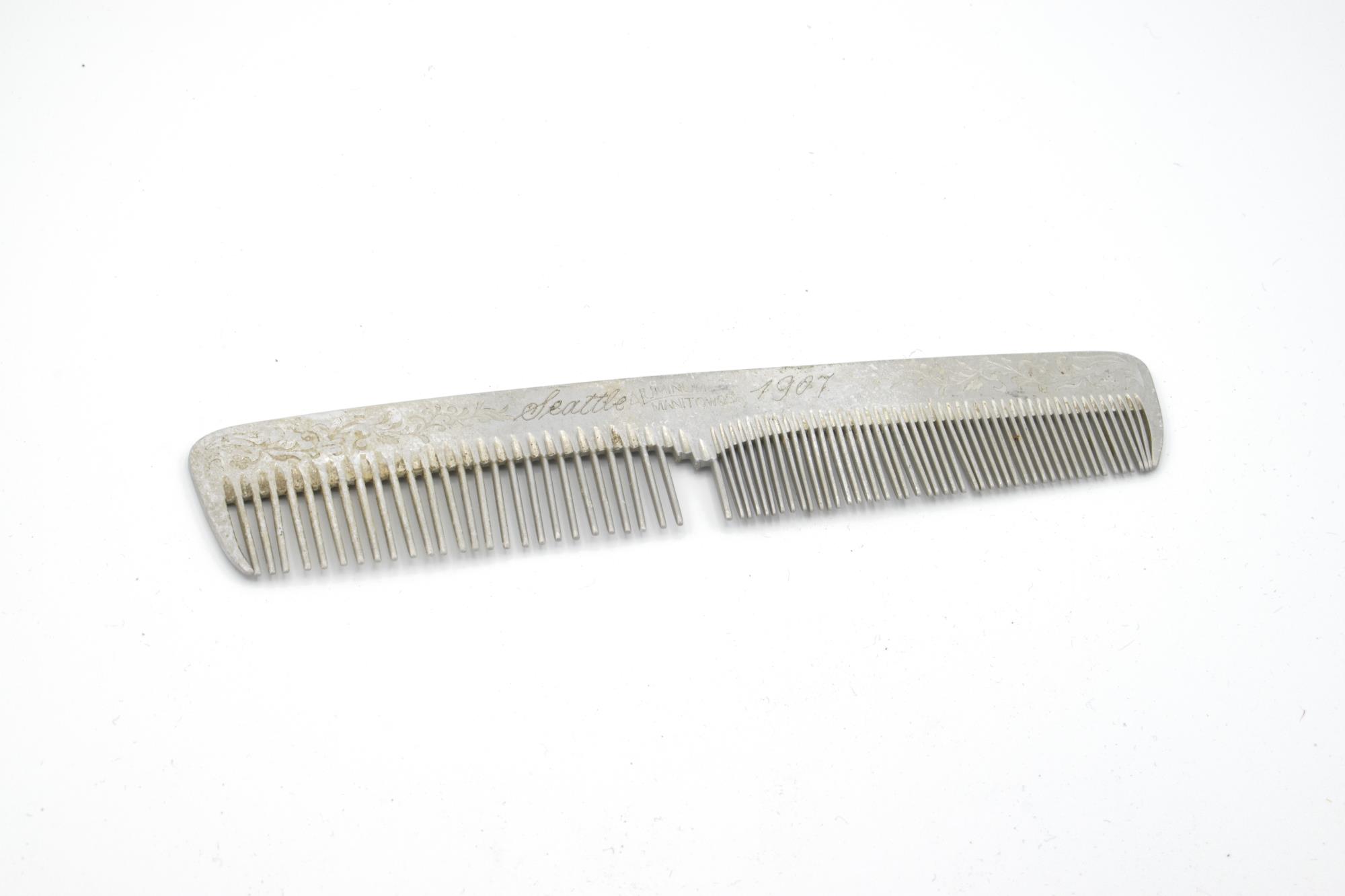Image of Aluminum comb engraved with 