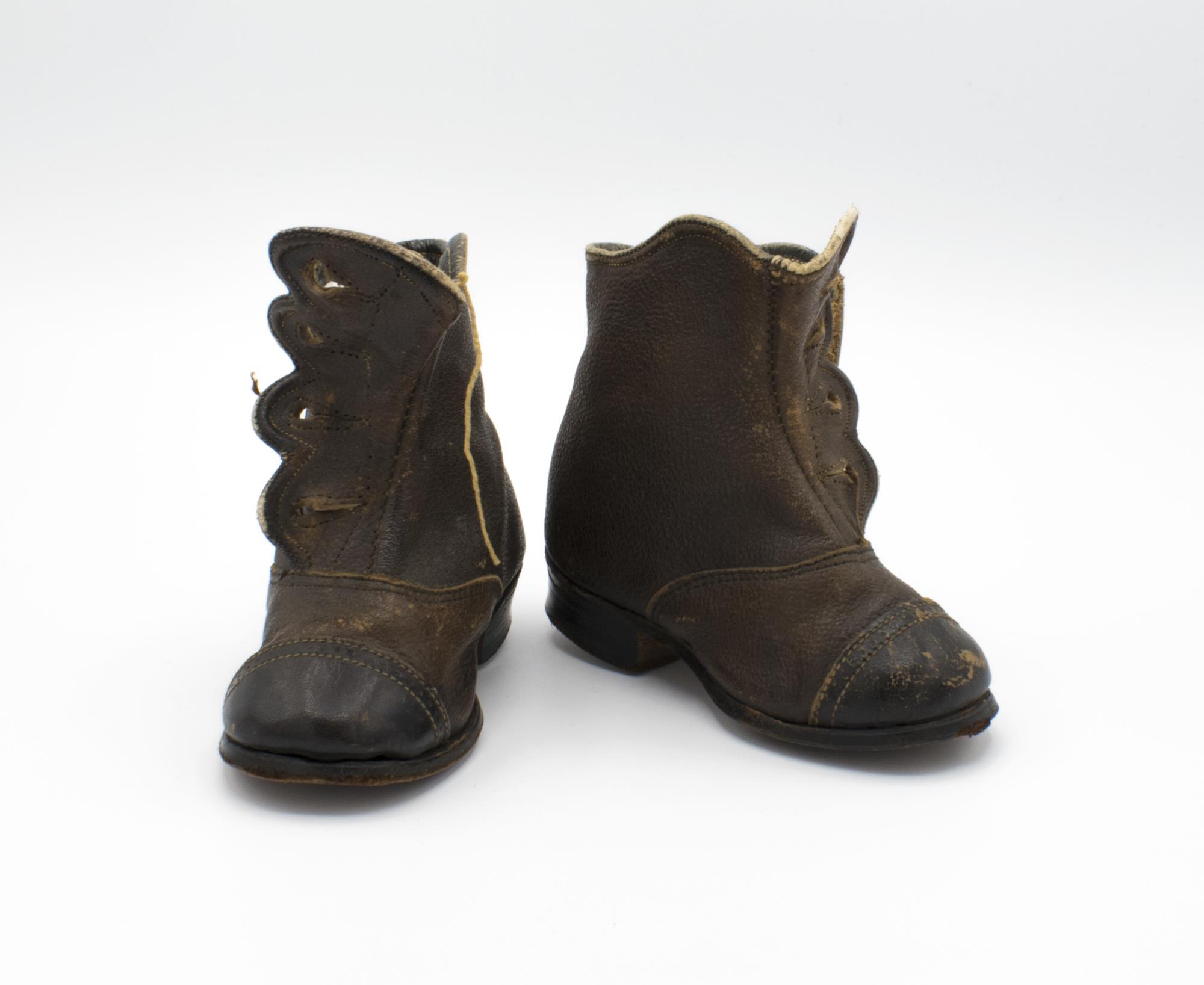 Image of Child's brown shoes with black toe caps, ca. 1858