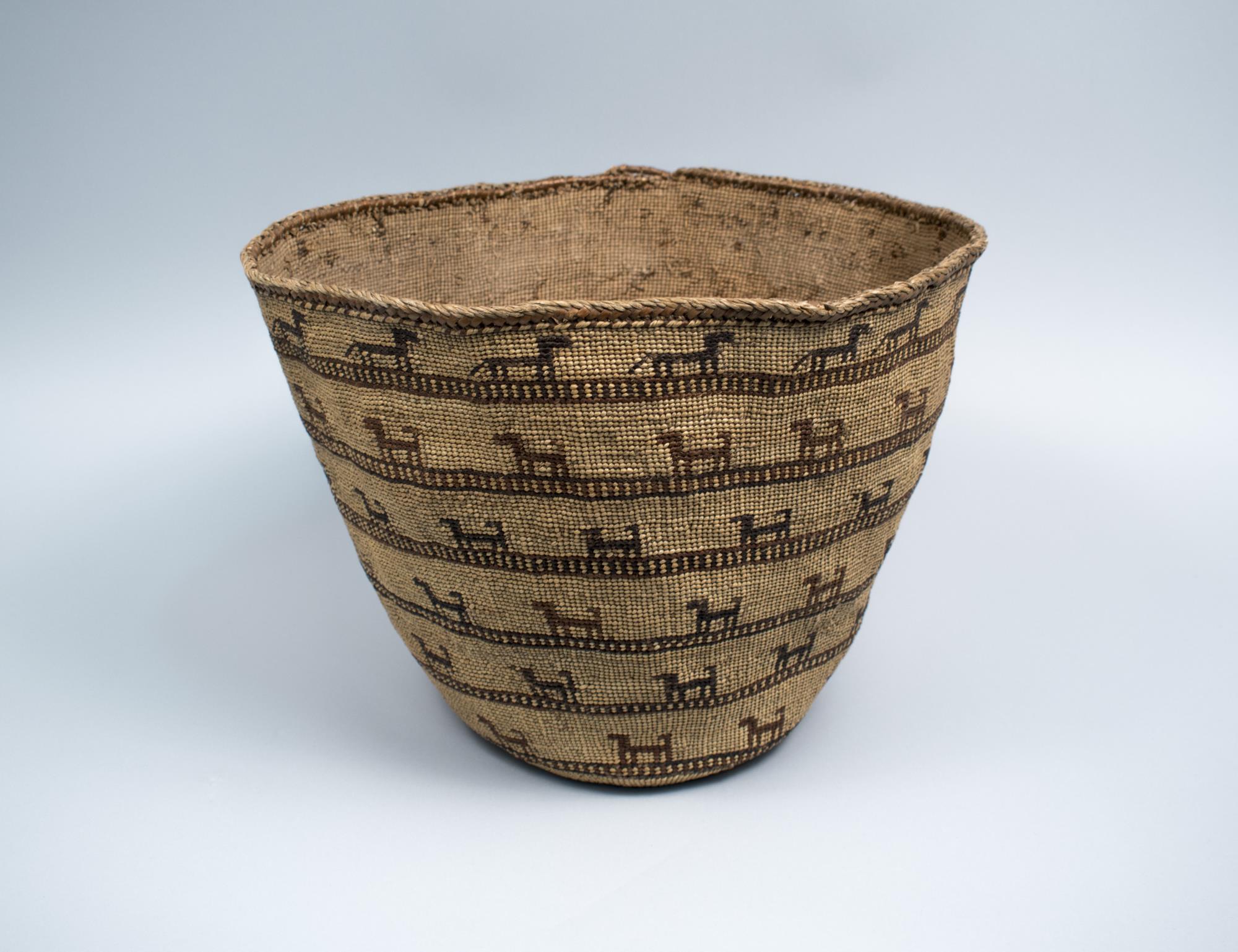 Image of Skokomish basket featuring wolves and dogs, ca. 1900