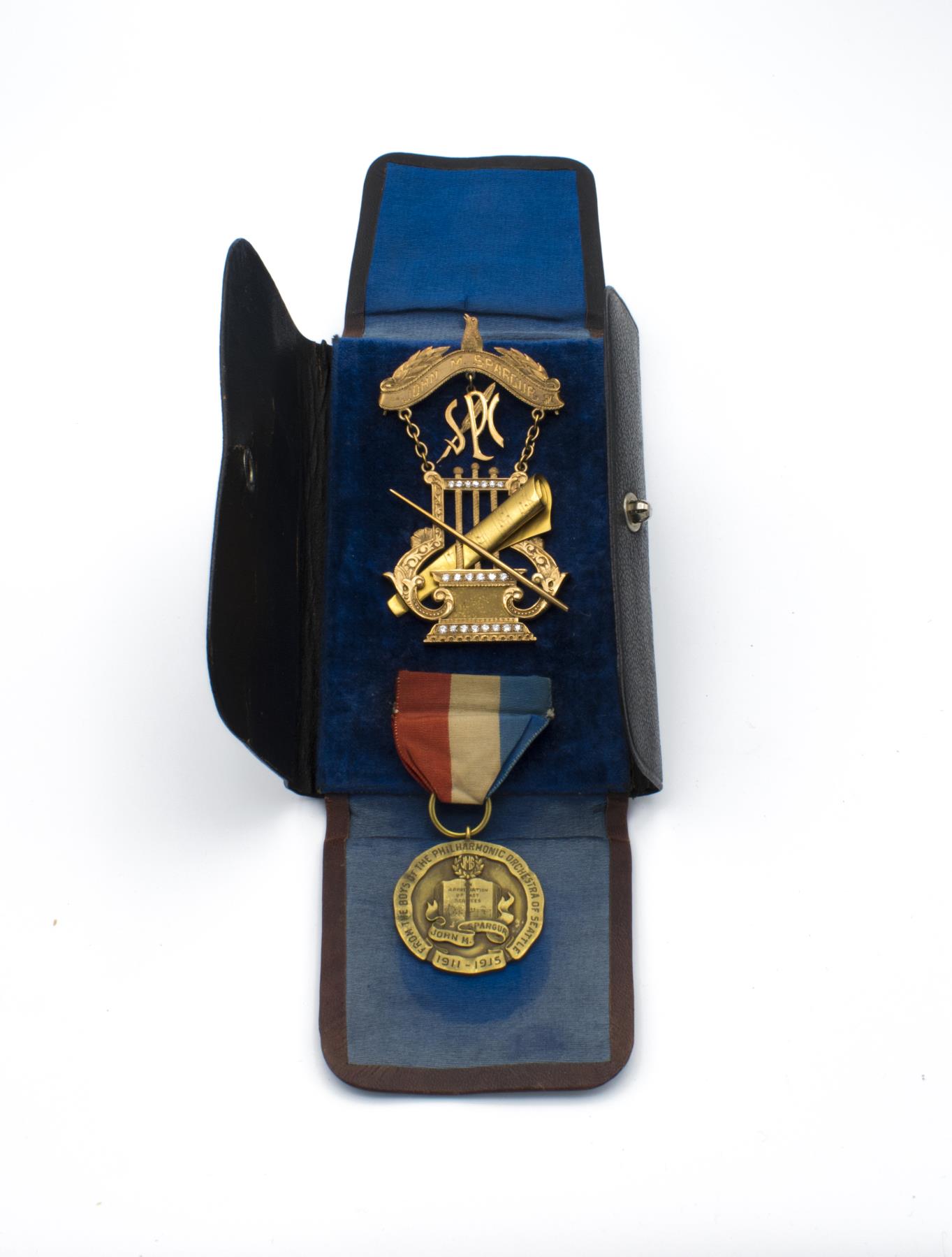 Image of Medal and Pin presented to John M. Spargur, Director, Seattle Philharmonic Orchestra, 1911-1916