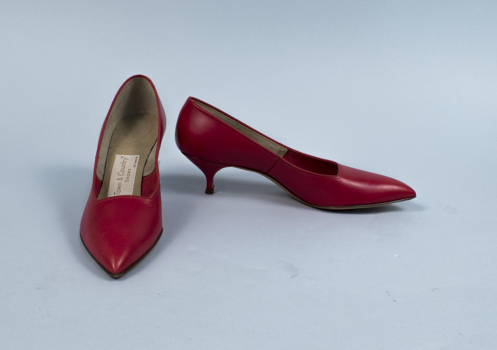 Image of Pair of red heel pumps, ca. 1963