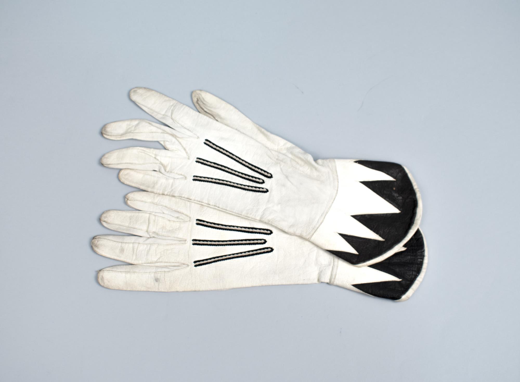 Image of Black and white leather gloves sold at MacDougall & Southwick in Seattle, ca. 1910-1950