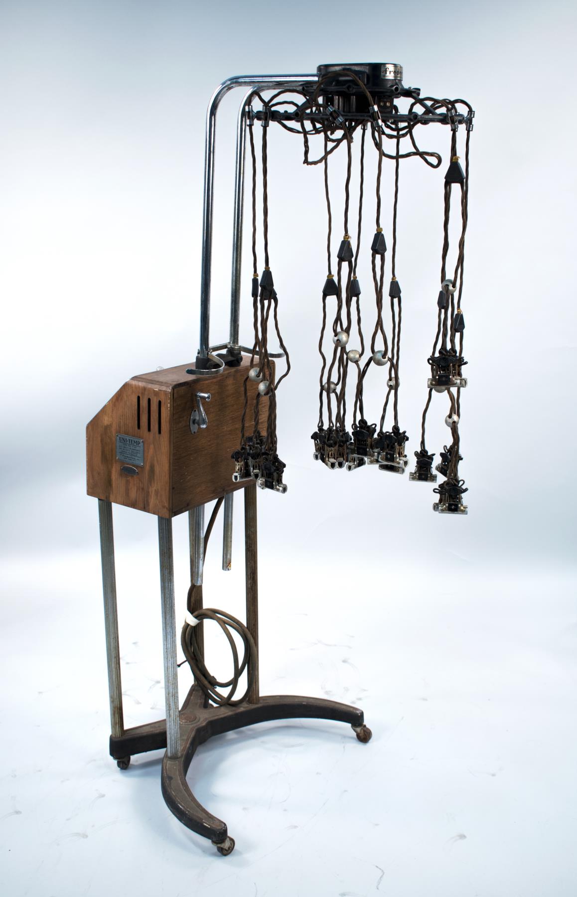 Image of Beauty parlor spiral waving machine, ca. 1930s