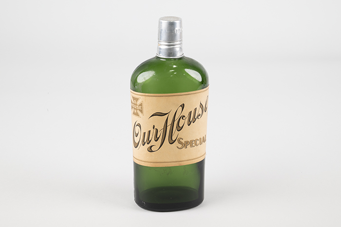 Image of Set of four liquor bottles from the Our House restaurant and hotel in Seattle, ca. 1898-1958