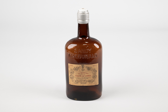 Image of Set of four liquor bottles from the Our House restaurant and hotel in Seattle, ca. 1898-1958