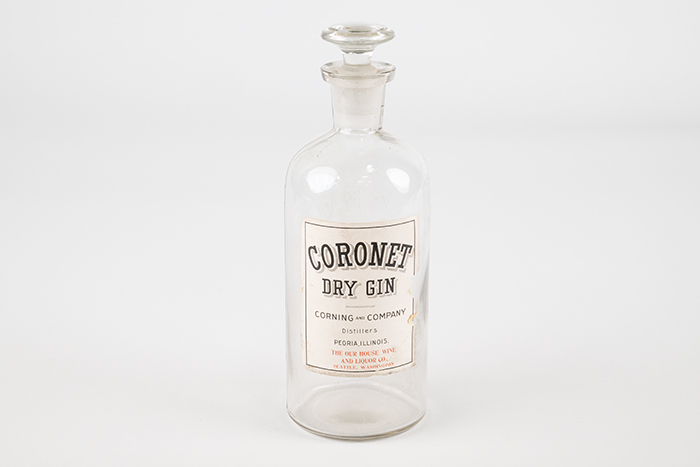 Image of Set of four liquor bottles from the Our House restaurant and hotel in Seattle, ca. 1898-1958
