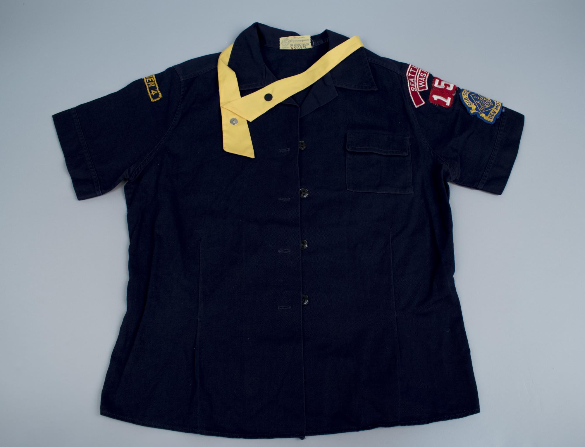 Image of Cub Scout den mother's blue cotton blouse, 1950s