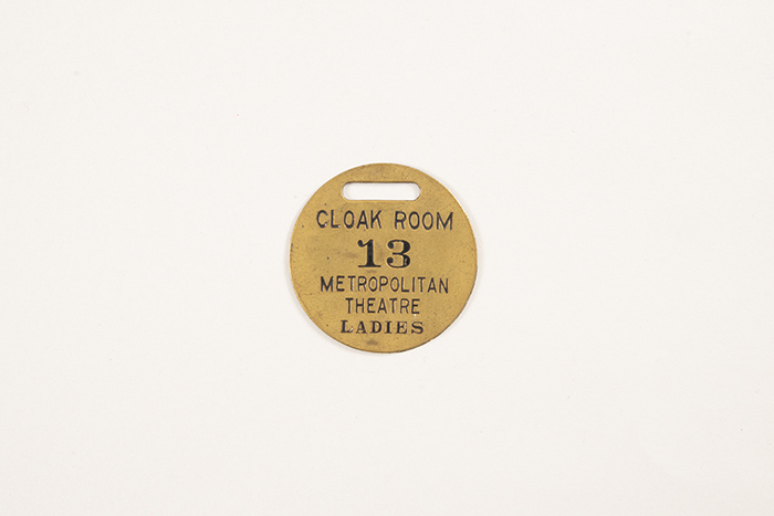 Image of Collection of theater coat check tags, ca. 1900-1950