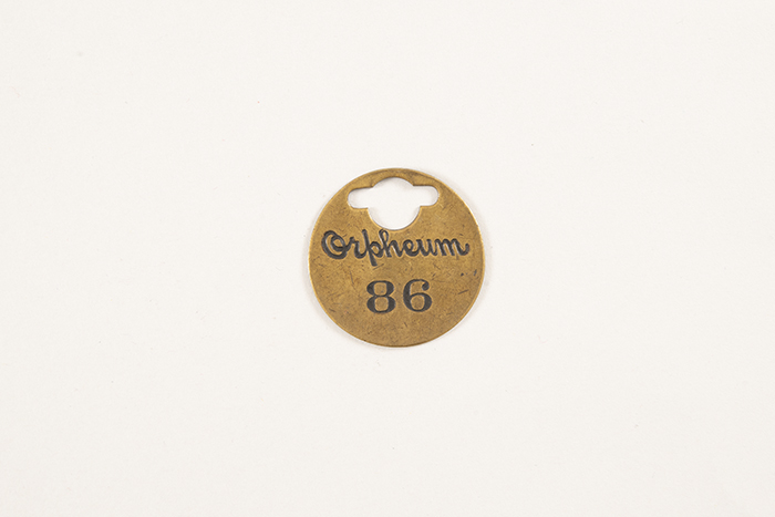 Image of Collection of theater coat check tags, ca. 1900-1950