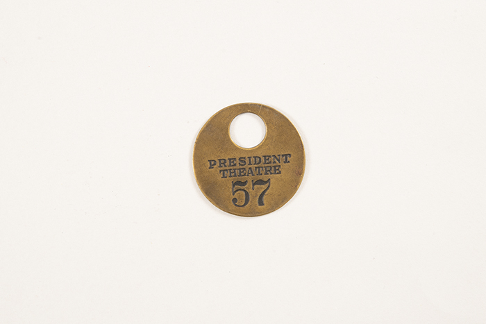 Image of Collection of theater coat check tags, ca. 1900-1950
