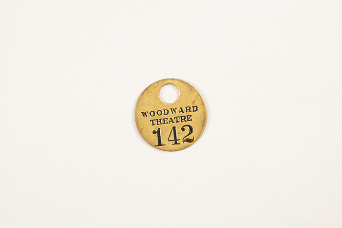 Image of Collection of theater coat check tags, ca. 1900-1950