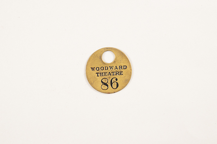 Image of Collection of theater coat check tags, ca. 1900-1950