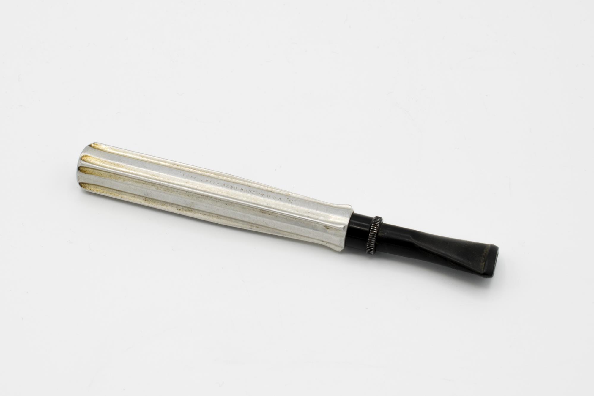 Image of Kirsten cigar holder patented by Professor Frederick K. Kirsten, ca. 1930-1950s