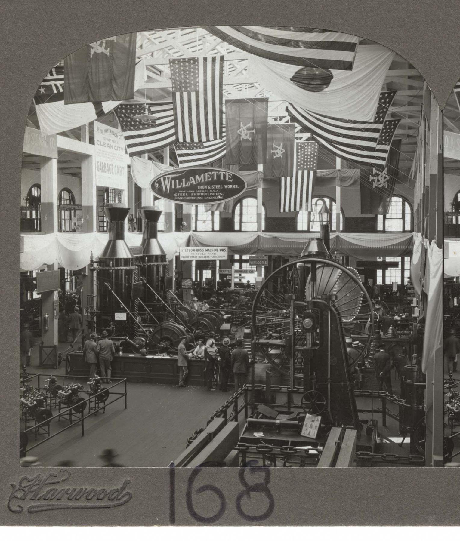 Image of Steam donkeys and other equipment on exhibit in Machinery Building at Alaska-Yukon-Pacific Exposition, Seattle, 1909