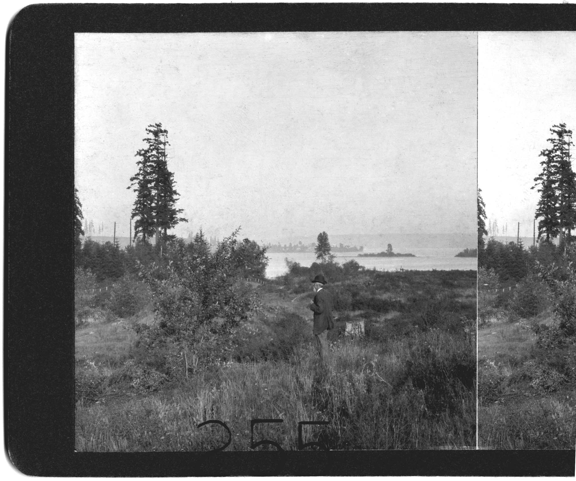 Image of F.M. Hopwood standing on current site of Montlake Bridge, Seattle, 1907