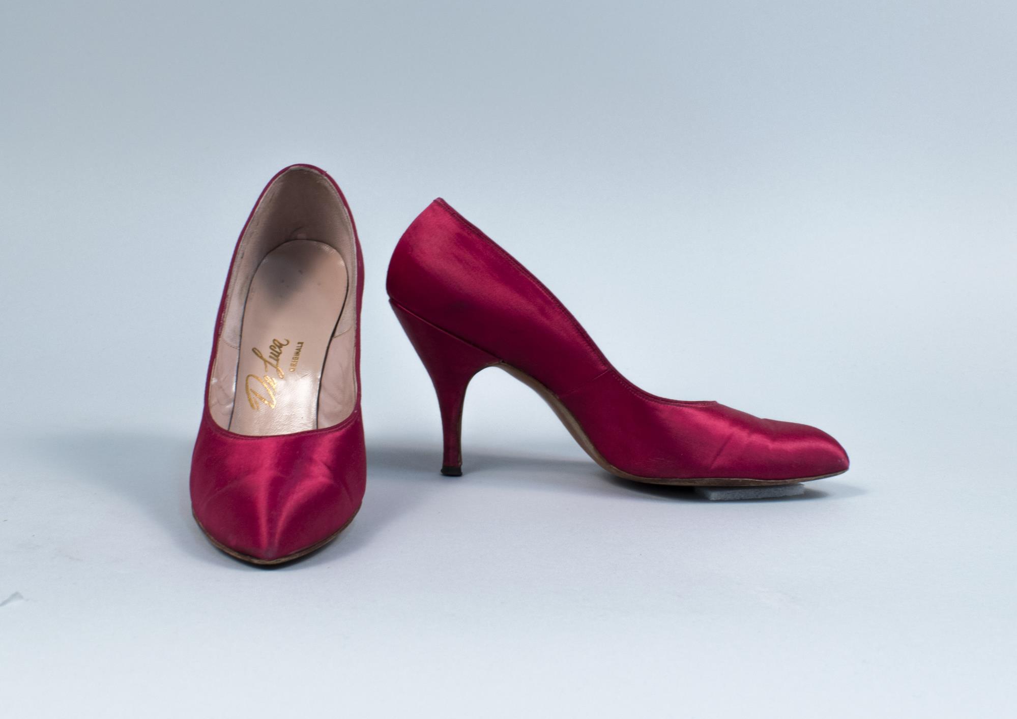 Image of Pair of hot pink fabric pumps from Best's Apparel, 
