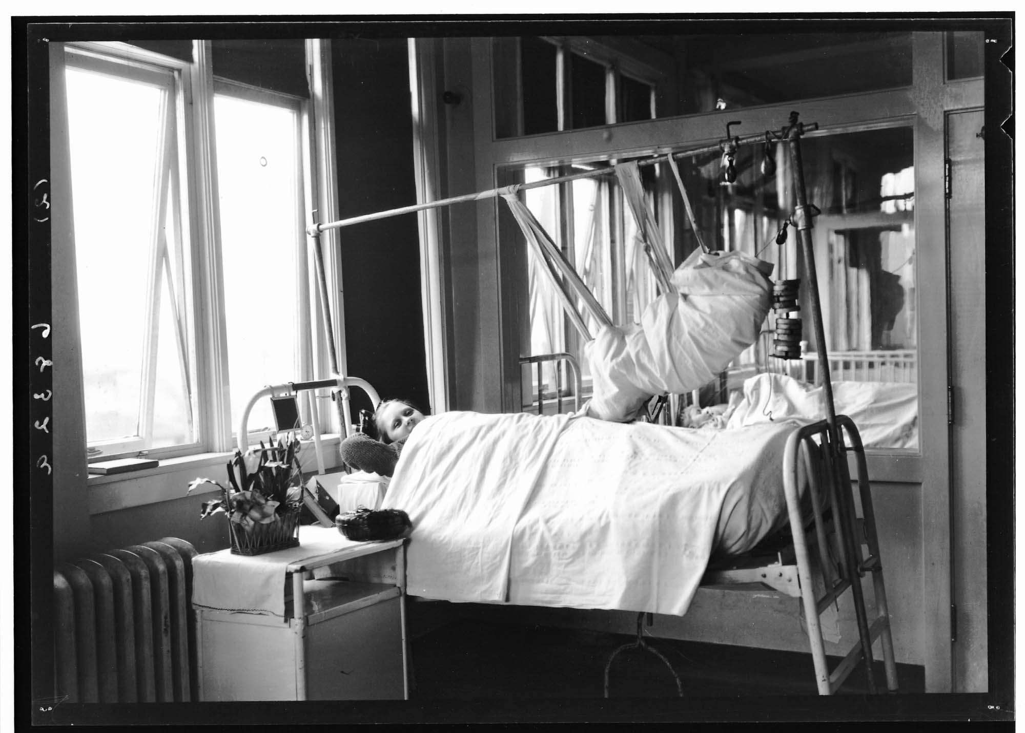 Image of Ruth Anderson with leg in traction, Seattle, circa 1930