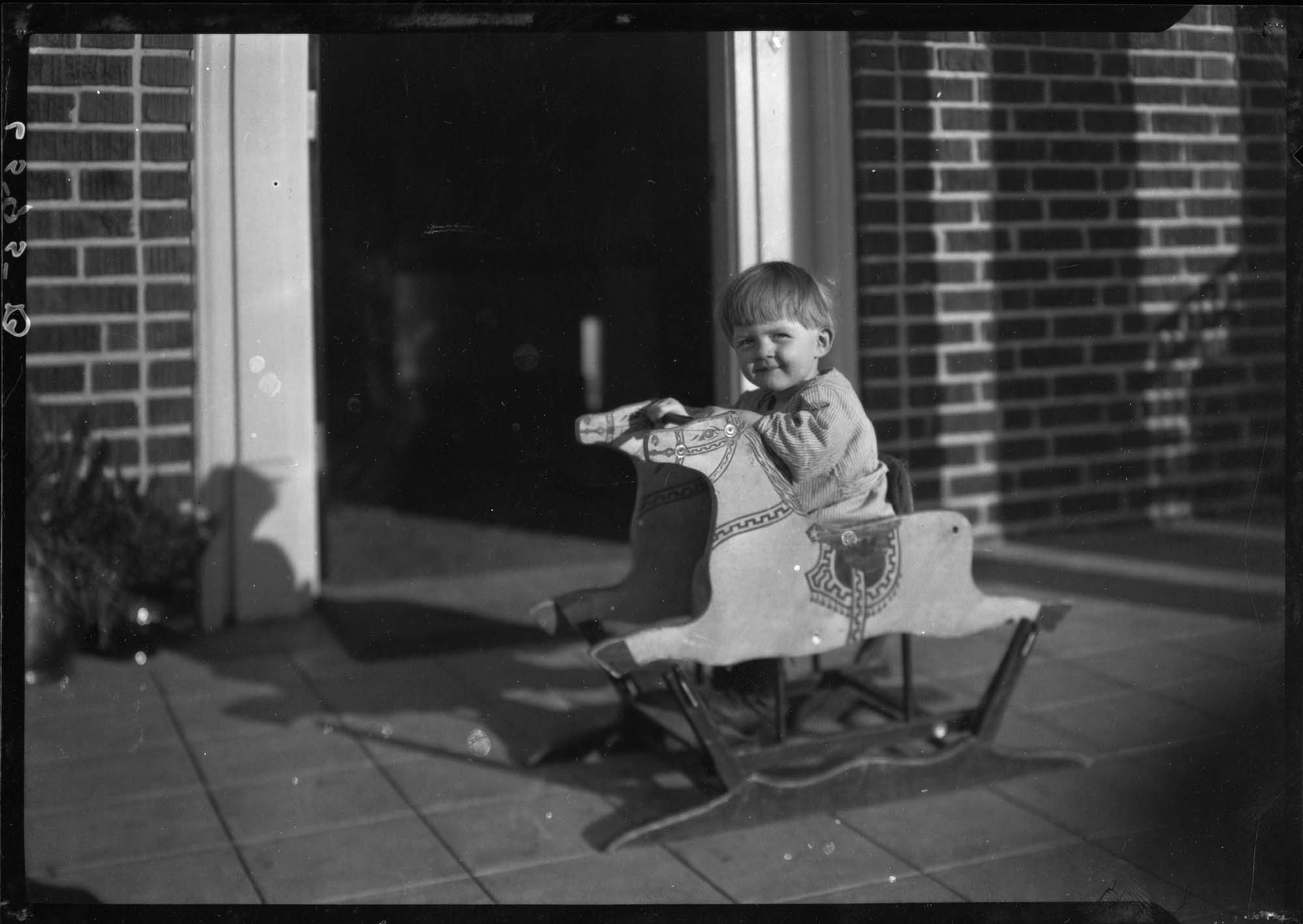 Image of Child on rocking horse at Seattle Day Nursery, Seattle, circa 1930