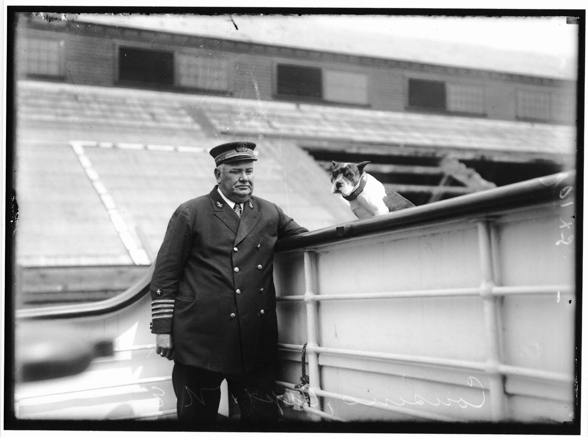 Image of Captain N.E. Cousins with dog, Seattle, circa 1920