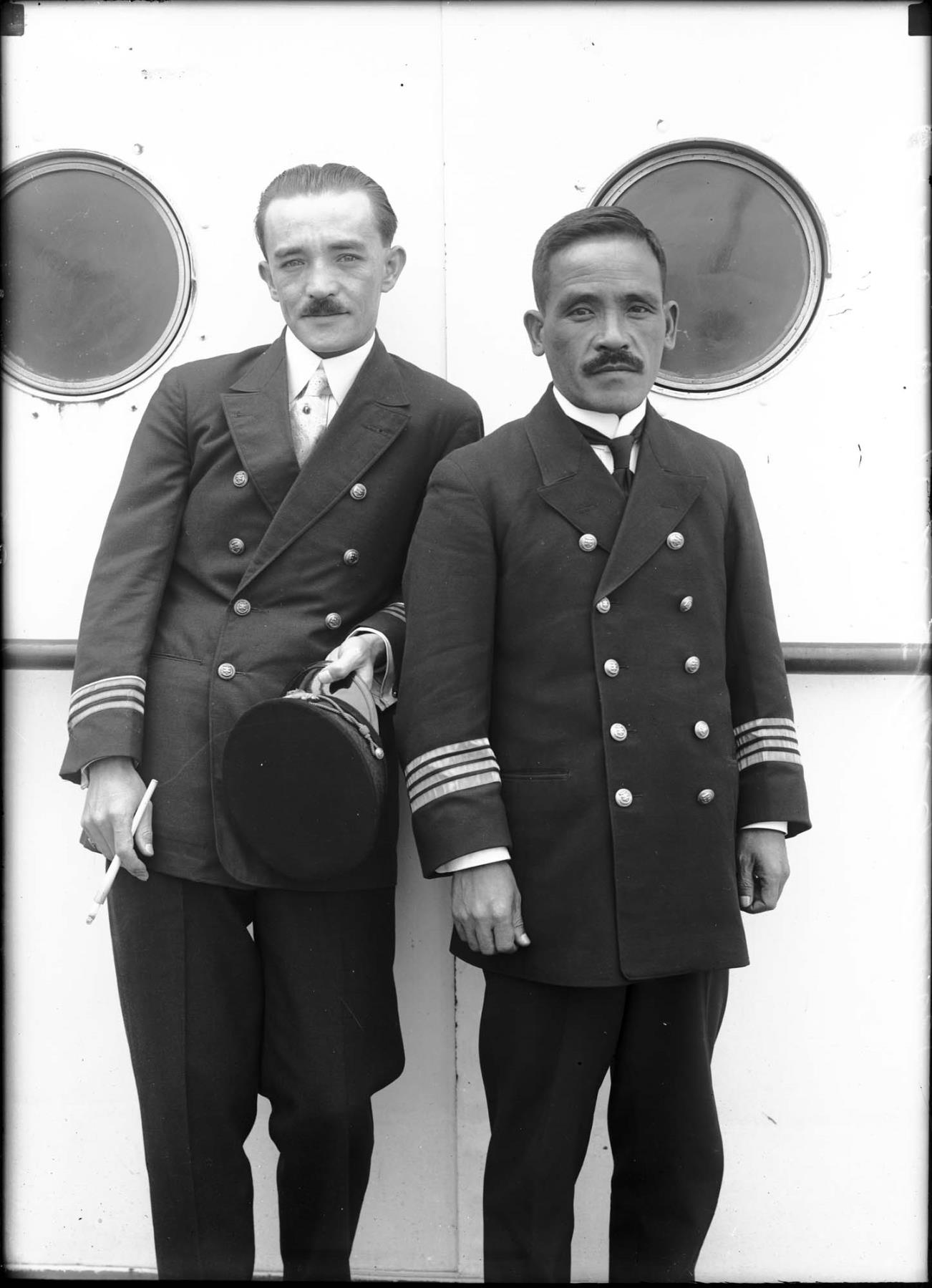 Image of Captain D. Fuchigami and another man on board ship, Seattle, circa 1925