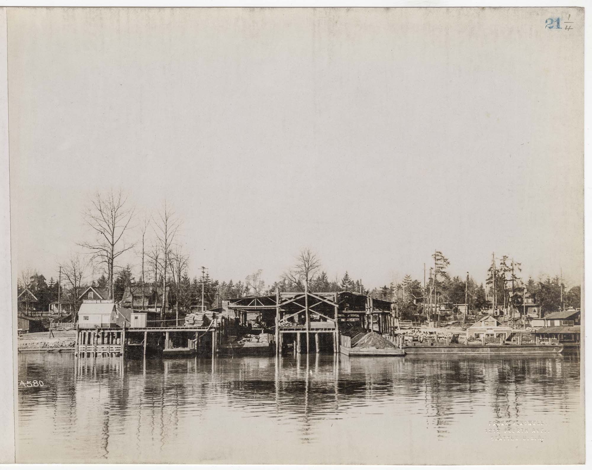 Image of Coal yard at Madison Park showing lake frontage and barges, Seattle, circa 1915