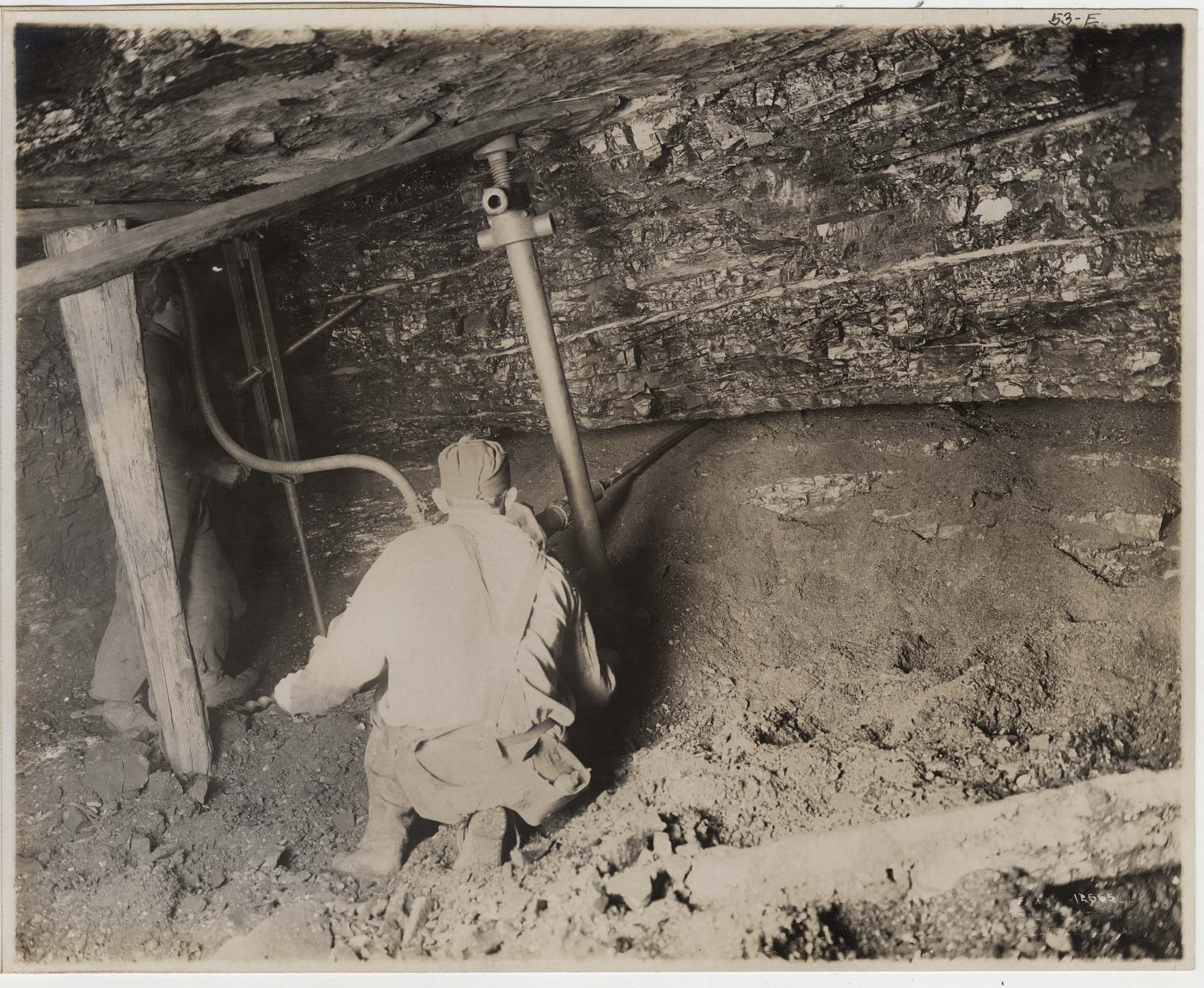 Image of Man using pneumatic drill in Issaquah mine, circa 1915