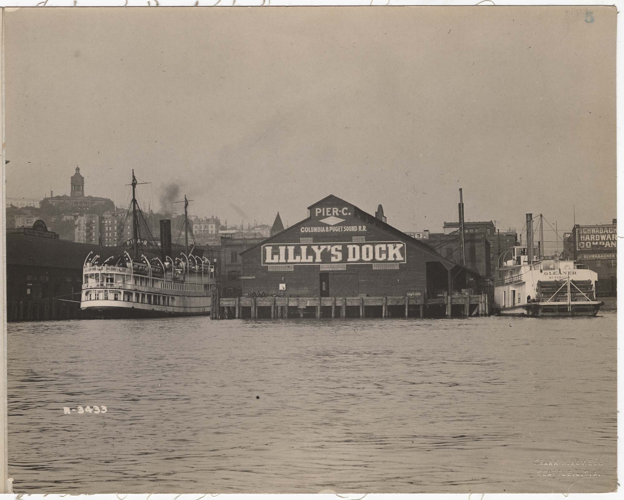 Image of Columbia & Puget Sound Railroad Pier C, with Steamers Gleaner and City of Seattle, Seattle, circa 1907