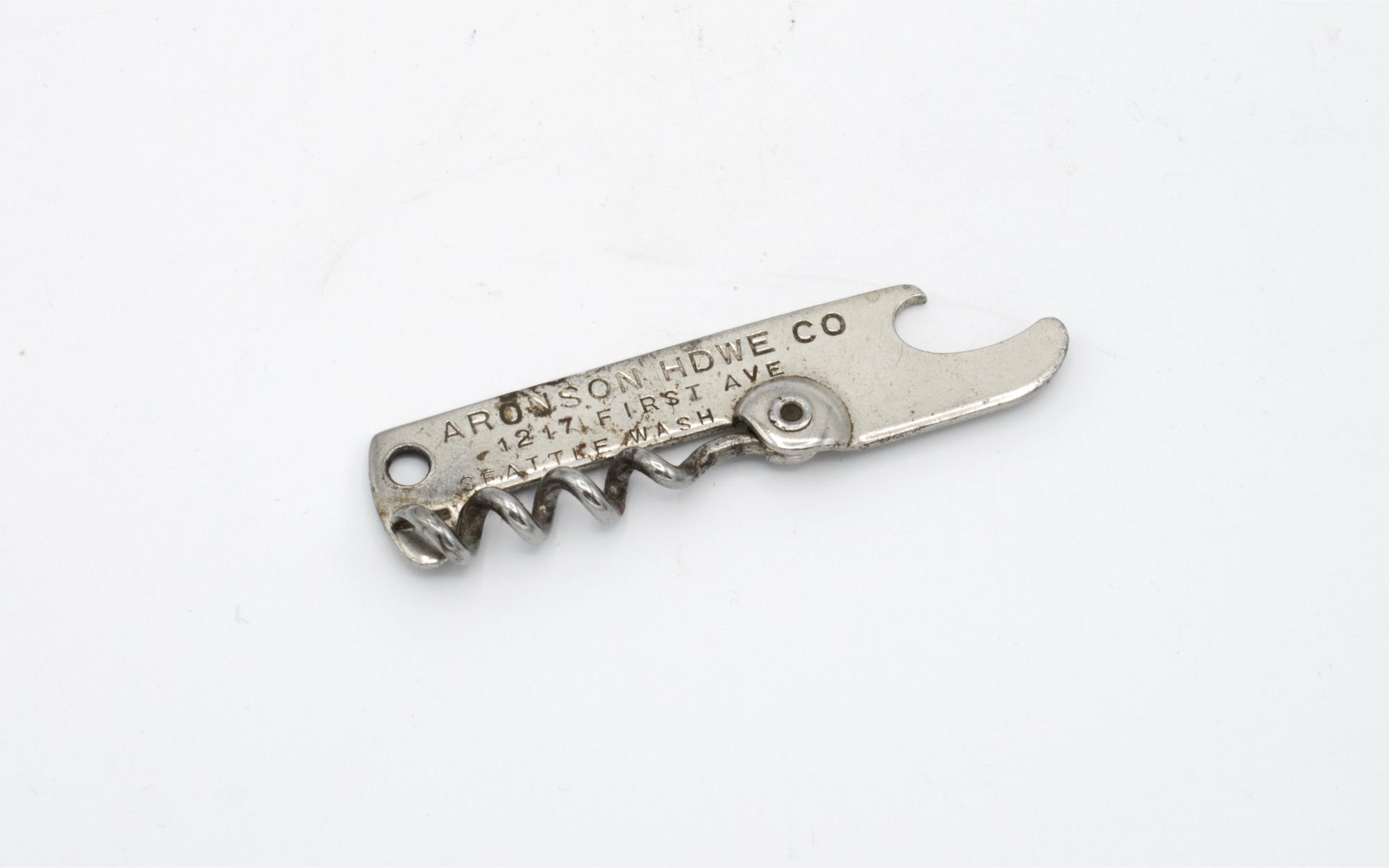 Image of Metal folding bottle opener advertising Aronson Howe, Seattle, ca. 1900