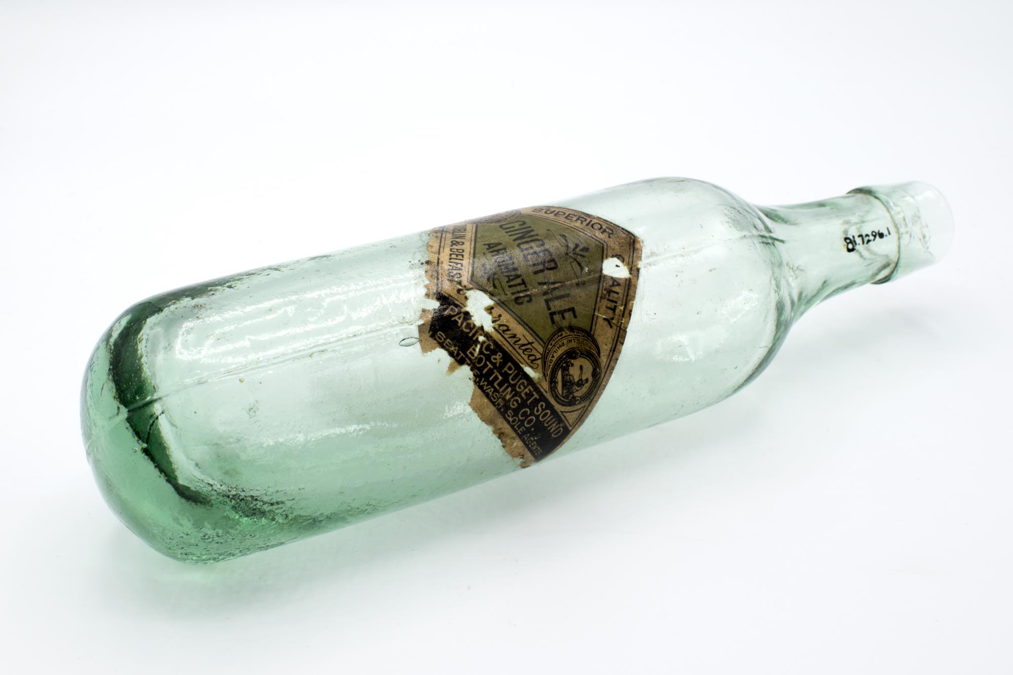 Image of Green glass soda bottle from Pacific & Puget Sound Bottling Company, Seattle, early 1900s
