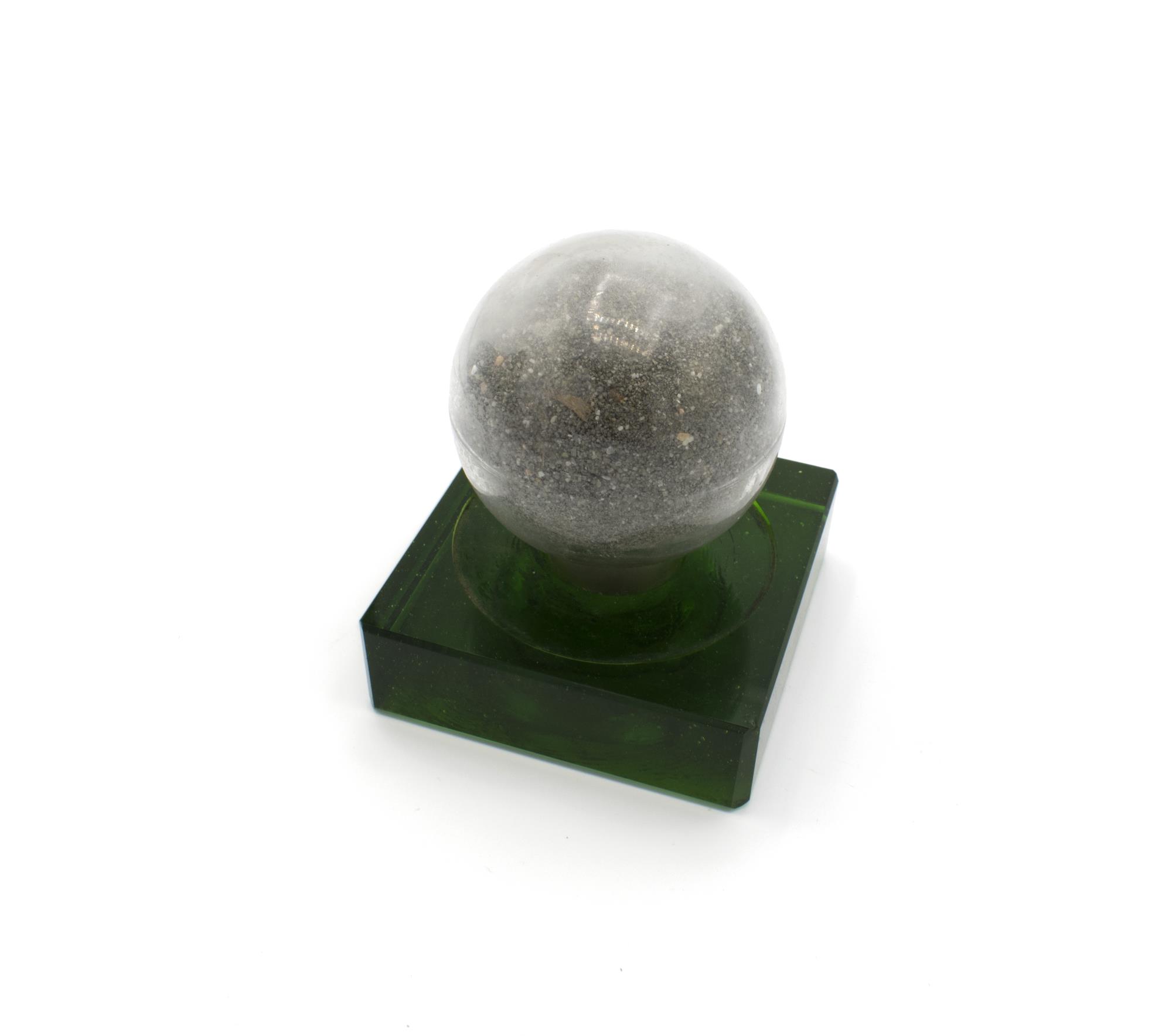 Image of Alaska-Yukon-Pacific Exposition (AYPE) souvenir glass globe or paperweight filled with silver mineral dust from Idaho, 1909