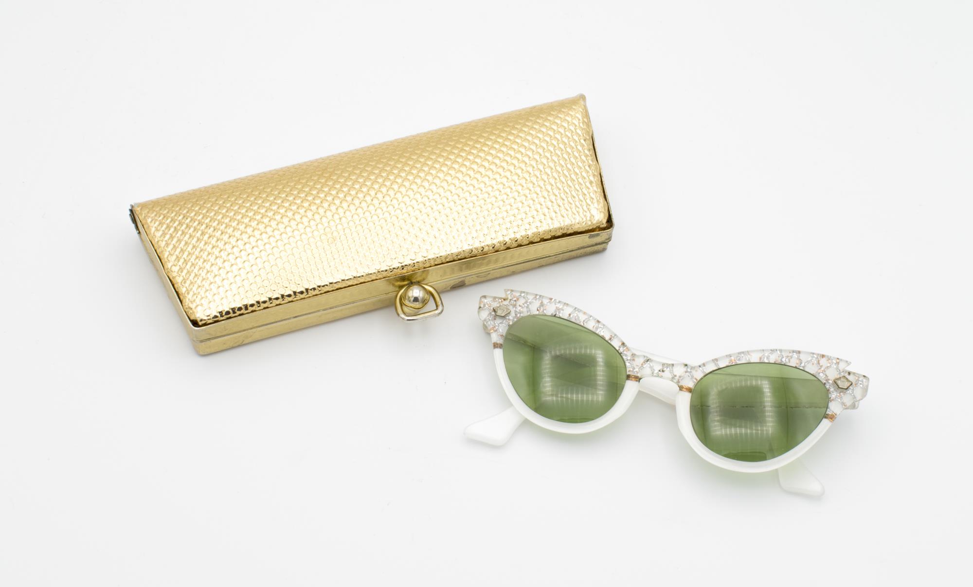Image of Prescription sunglasses in goldtone case, ca. 1960s-1970s