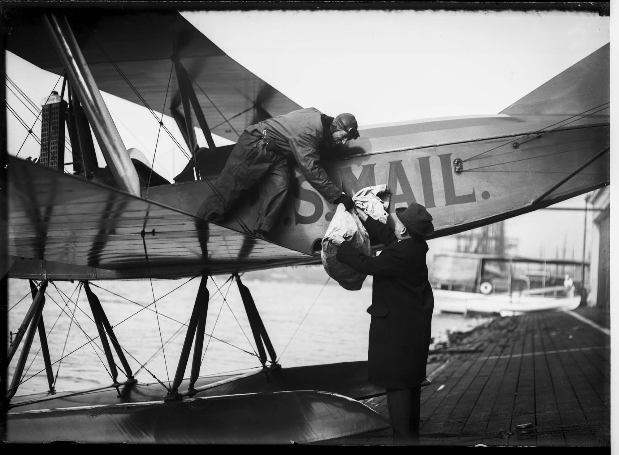 Image of Eddie Hubbard delivering air mail from Canada, circa 1920