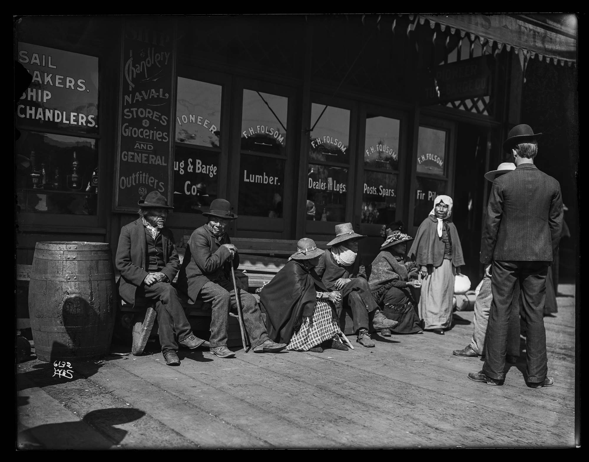 Image of Group of Suquamish people waiting at Colman Dock, Seattle, circa 1911