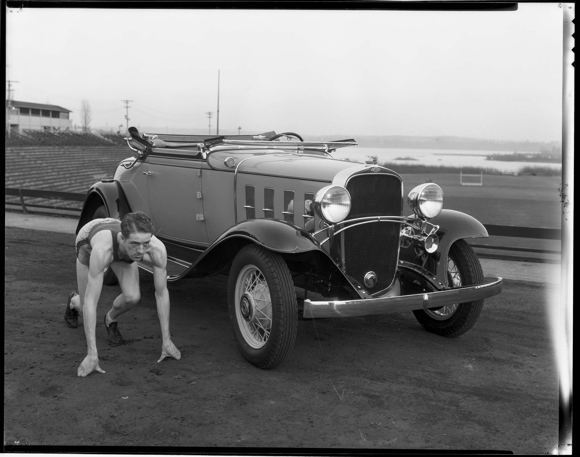 Image of Olympic runner Ed Genung and Chevrolet automobile, February 18, 1932