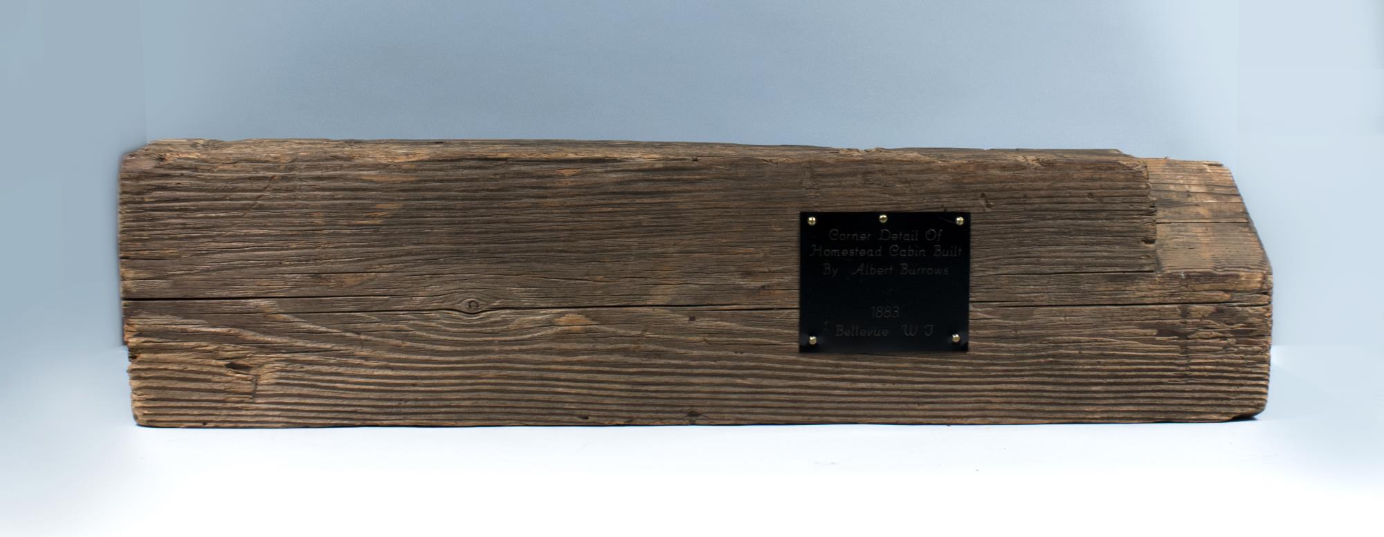 Image of Hand-hewn cedar log from homestead cabin built by Albert Burrows, 1883