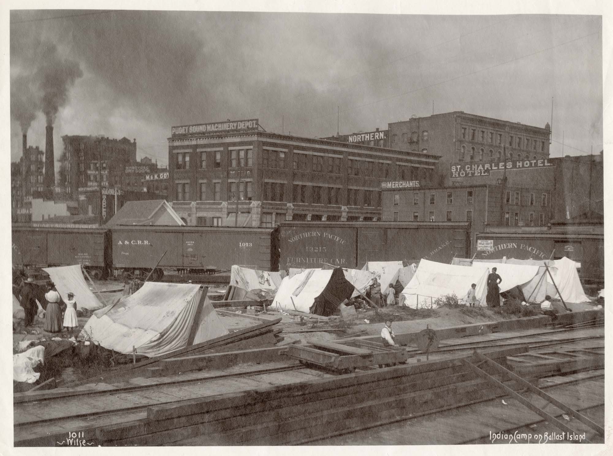 Image of Encampment of Indigenous people on Ballast Island at the Seattle waterfront, circa 1900