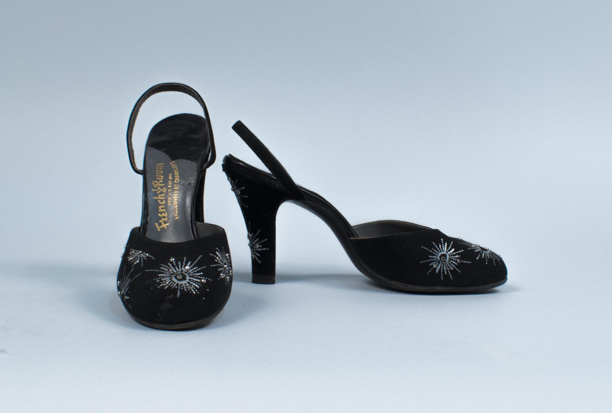 Image of Black sling-back pumps with silver fireworks decoration, ca. 1940s-1950s
