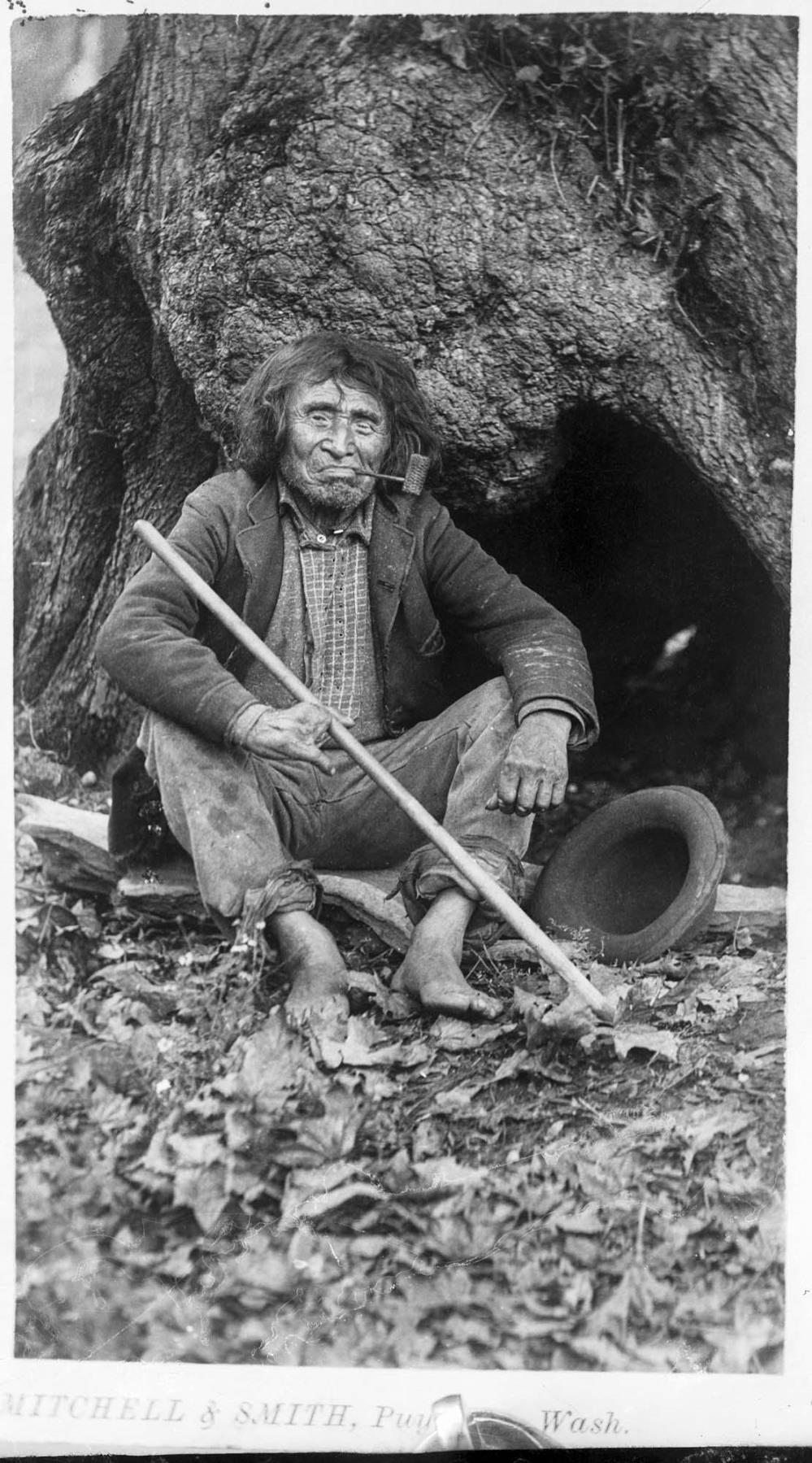 Image of Puget Sound Native man with pipe, circa 1900