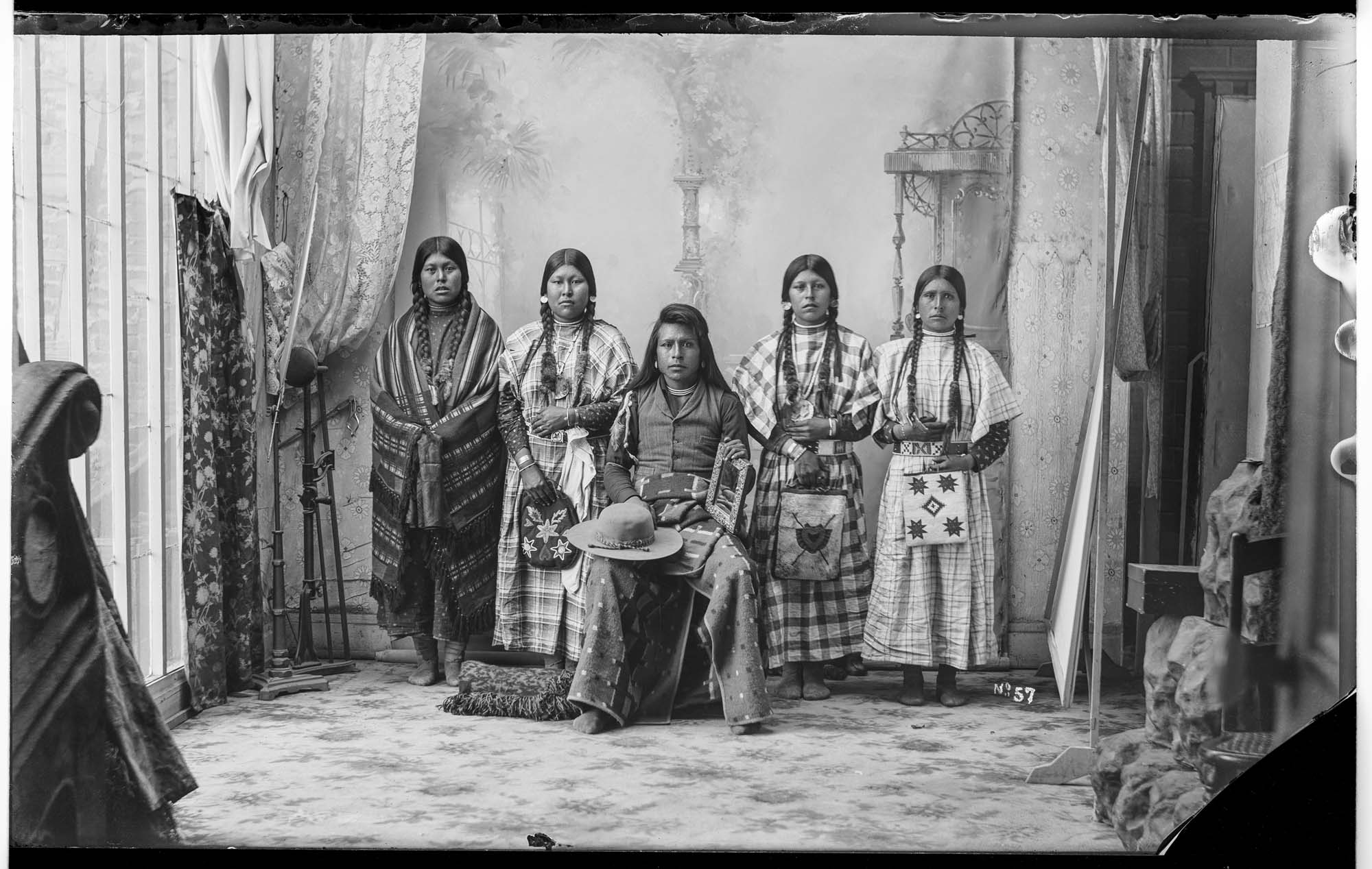 Image of Plateau group in a photography studio, circa 1900