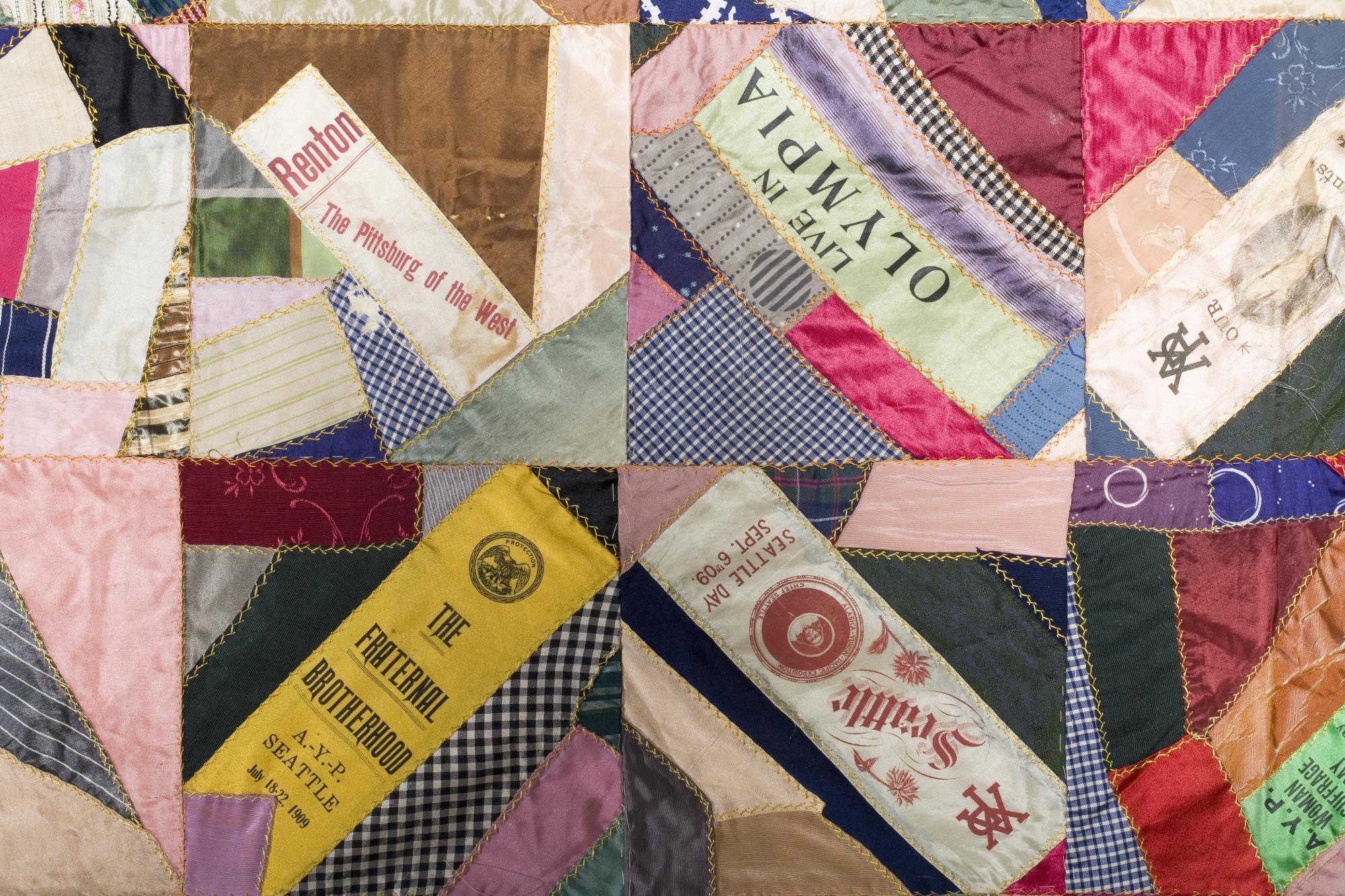 Image of Crazy quilt featuring commemorative ribbons from the Alaska-Yukon-Pacific Exposition (AYPE), 1911