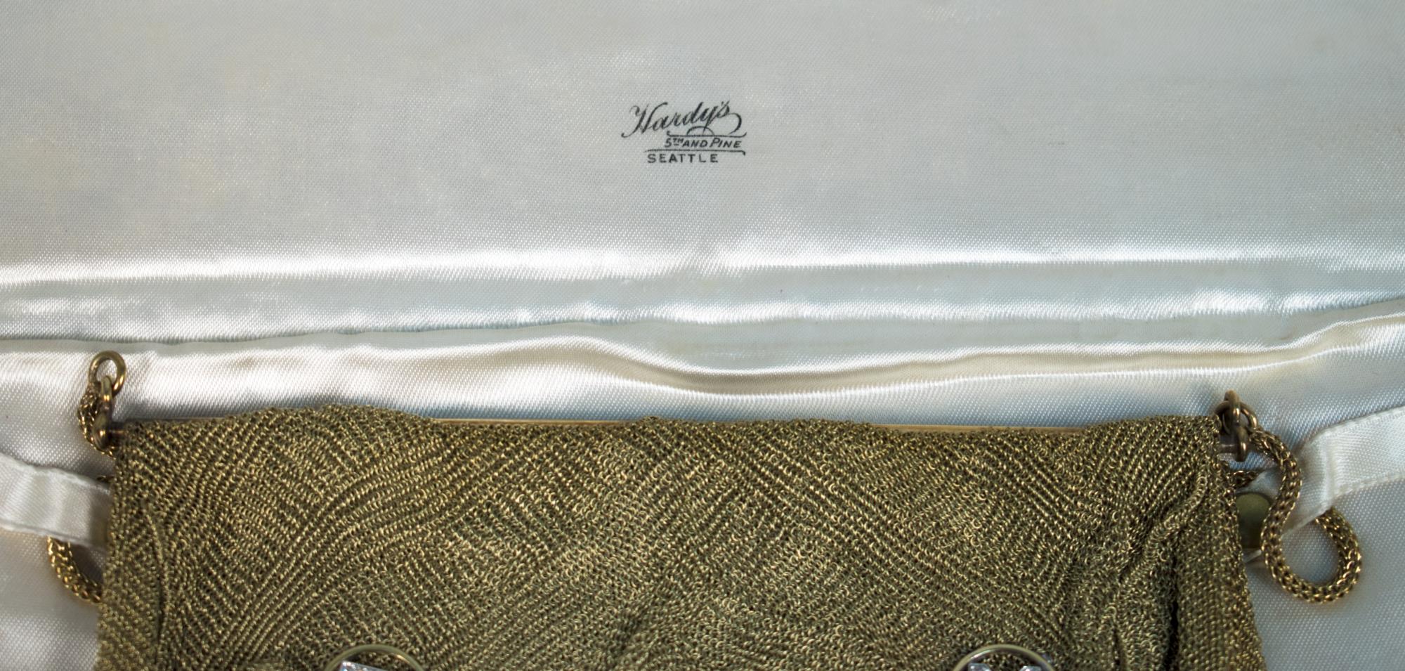 Image of White cloth case to hold gold mesh purse, ca. 1930-1940
