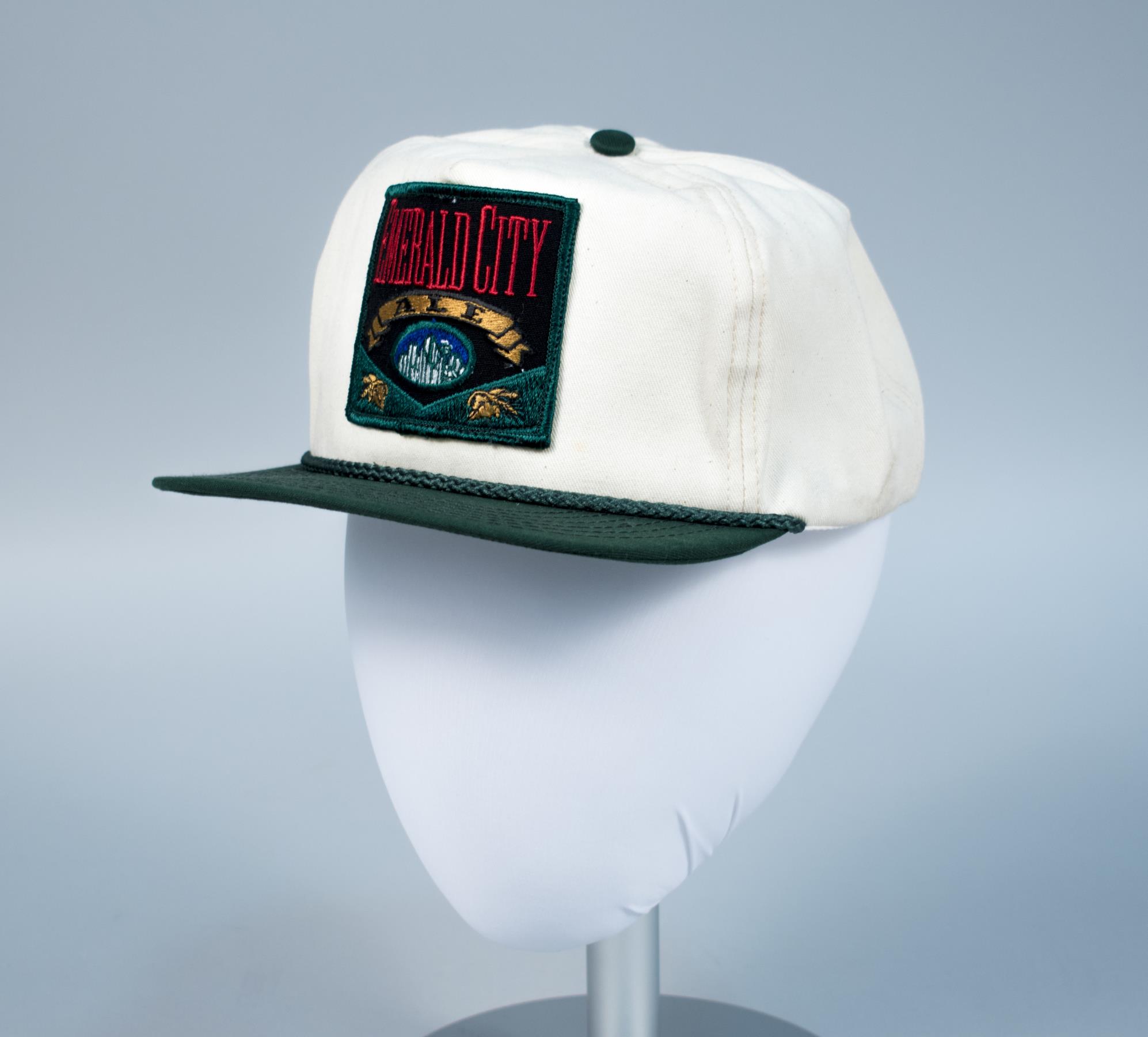 Image of Cap advertising Emerald City Ale from the Rainier Brewery, ca. 1992