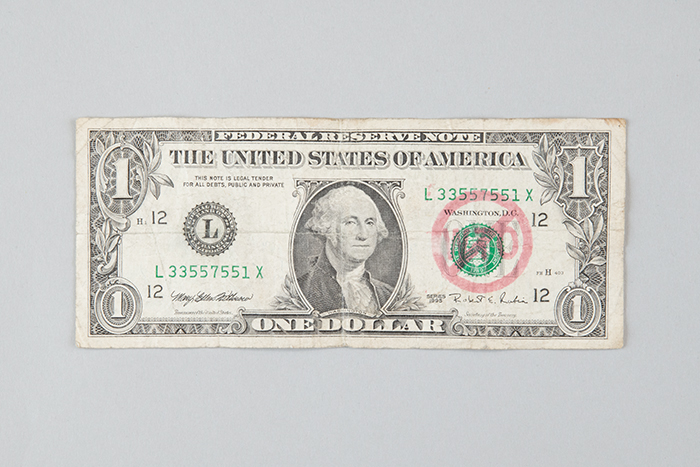 Image of Dollar bill from the World Trade Organization (WTO) protest, 1999