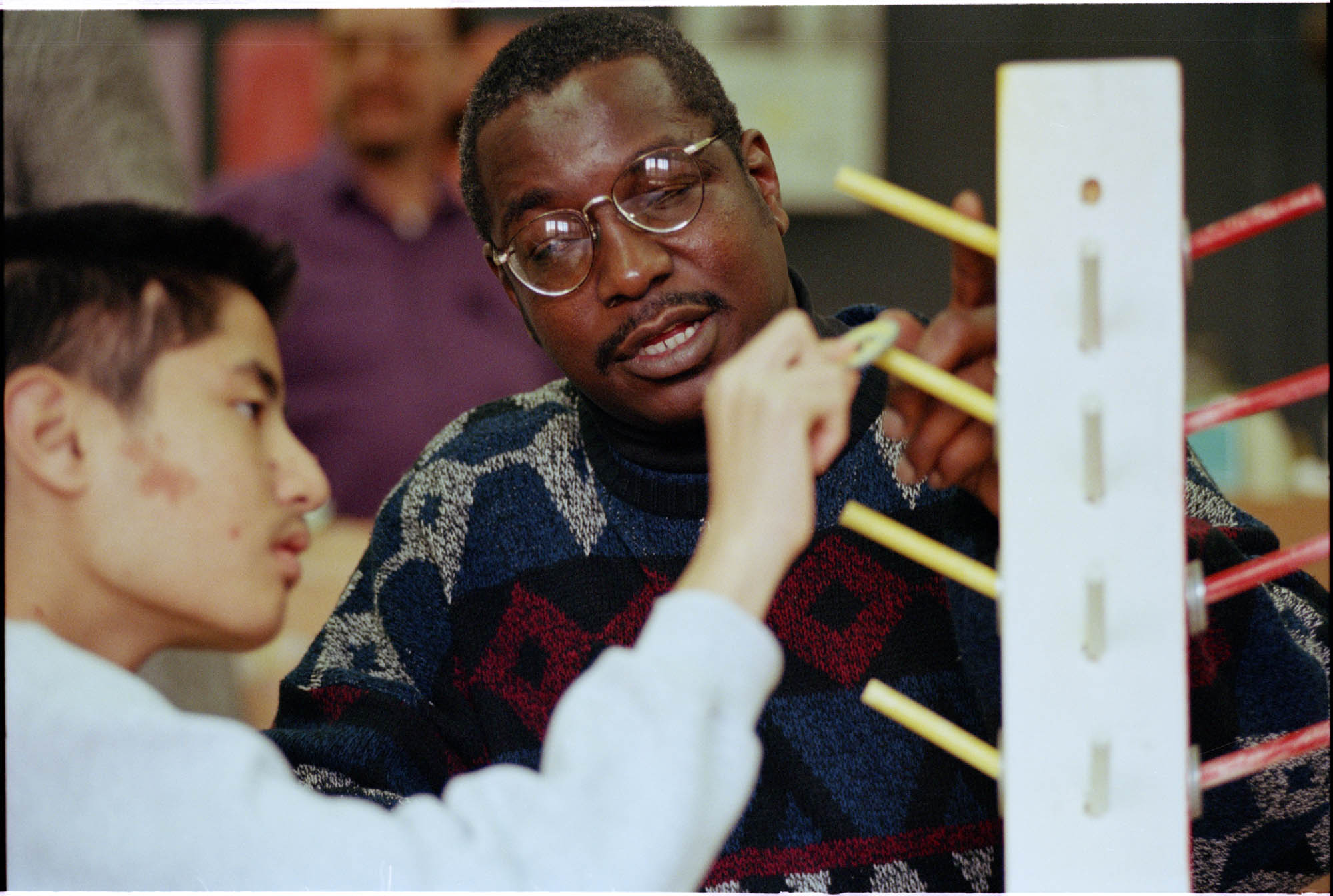 Image of Ray Seales working with student Giac Nguyen at Lincoln High School, Tacoma, March 7, 1997