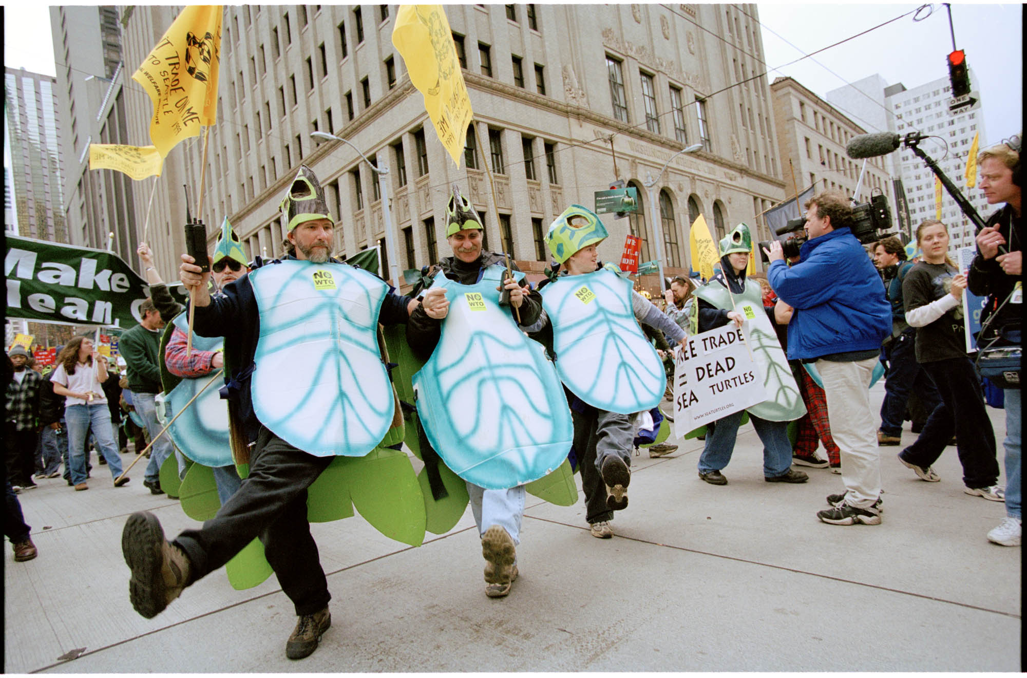 Image of People in turtle costumes dancing at WTO protest, Seattle, November 29, 1999
