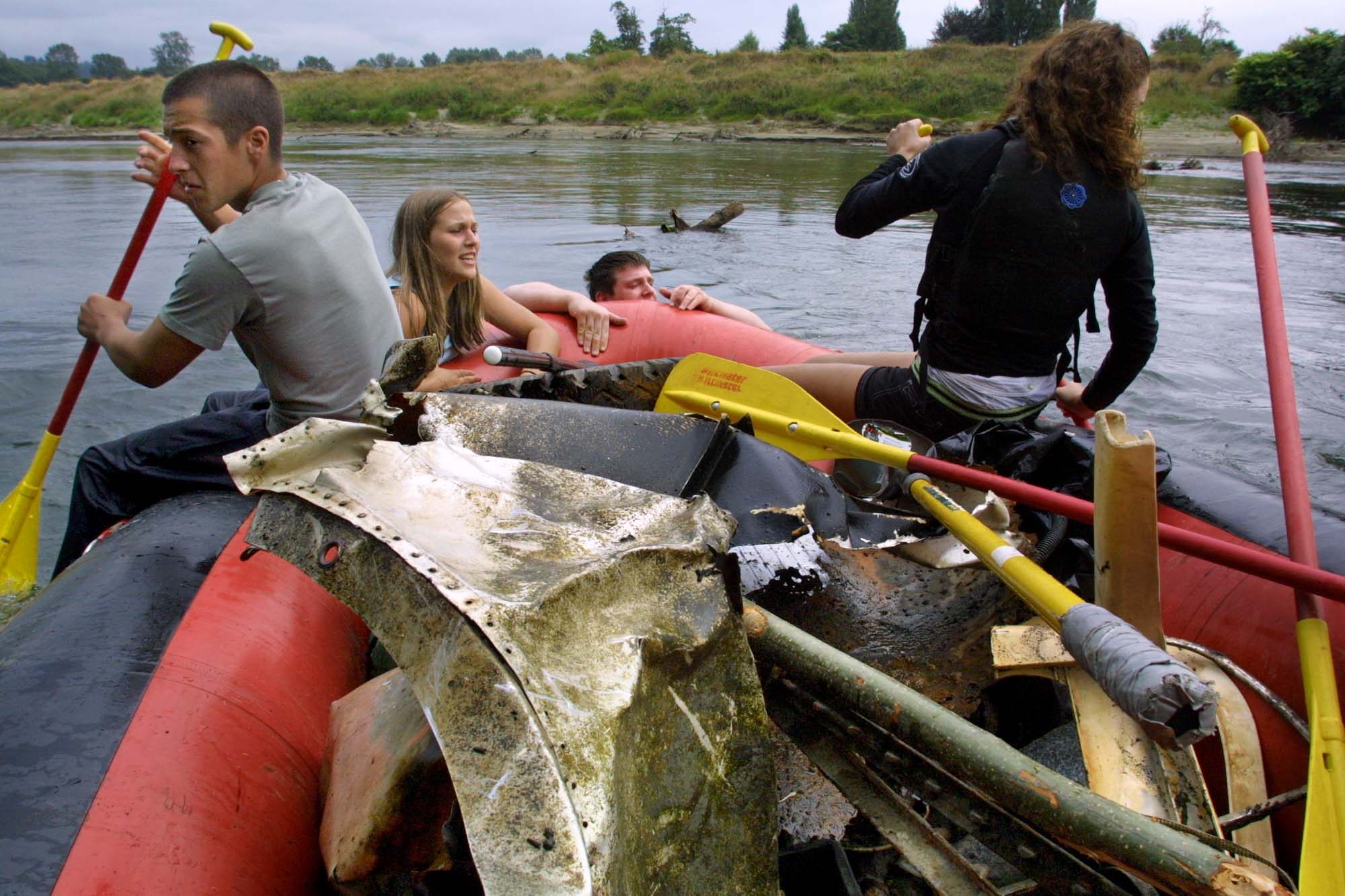 Image of Volunteers cleaning trash from the Snoqualmie River, August 25, 2002