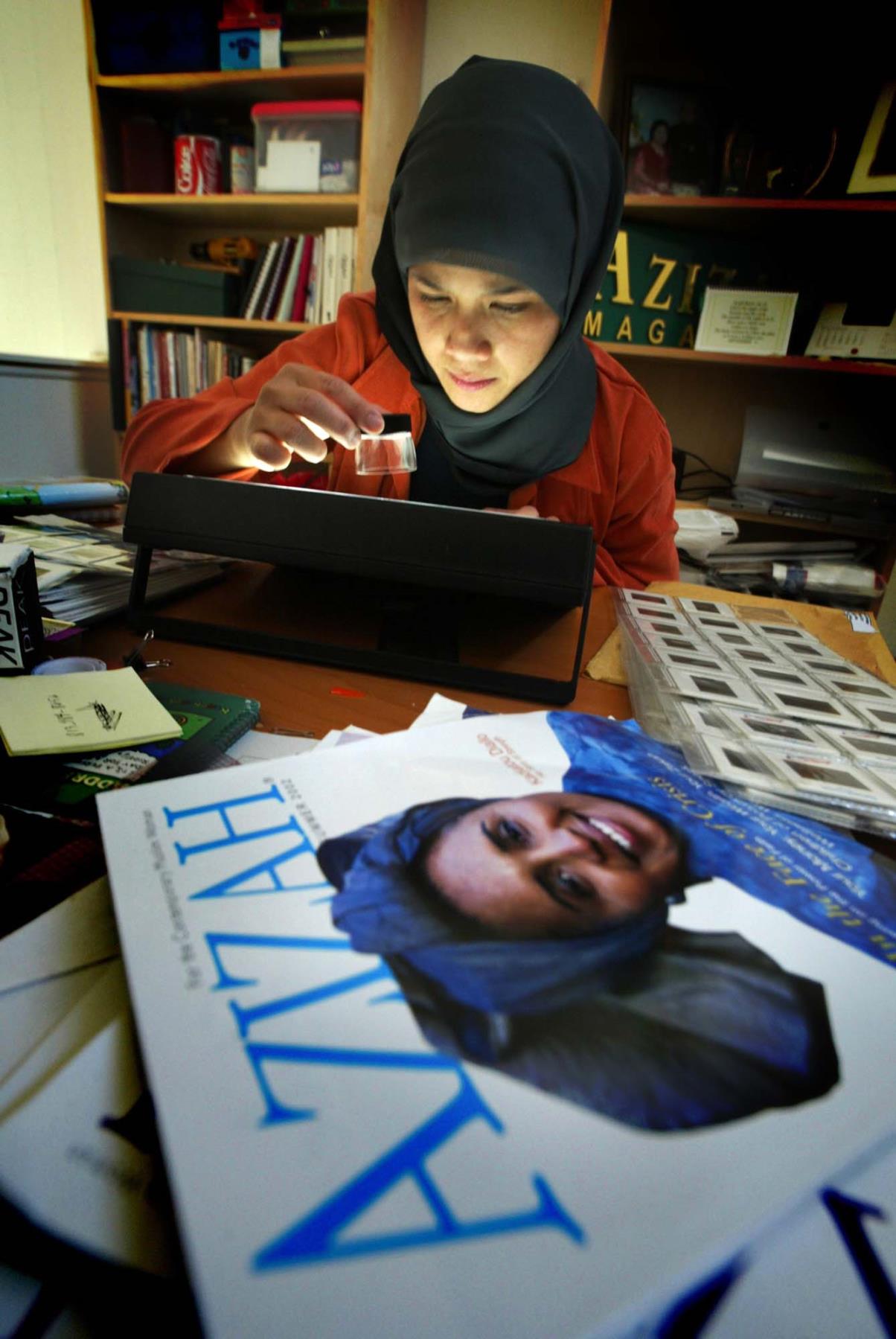 Image of Marlina Soerakoesoemah editing fashion pictures for Azizah magazine, Redmond, September 2002