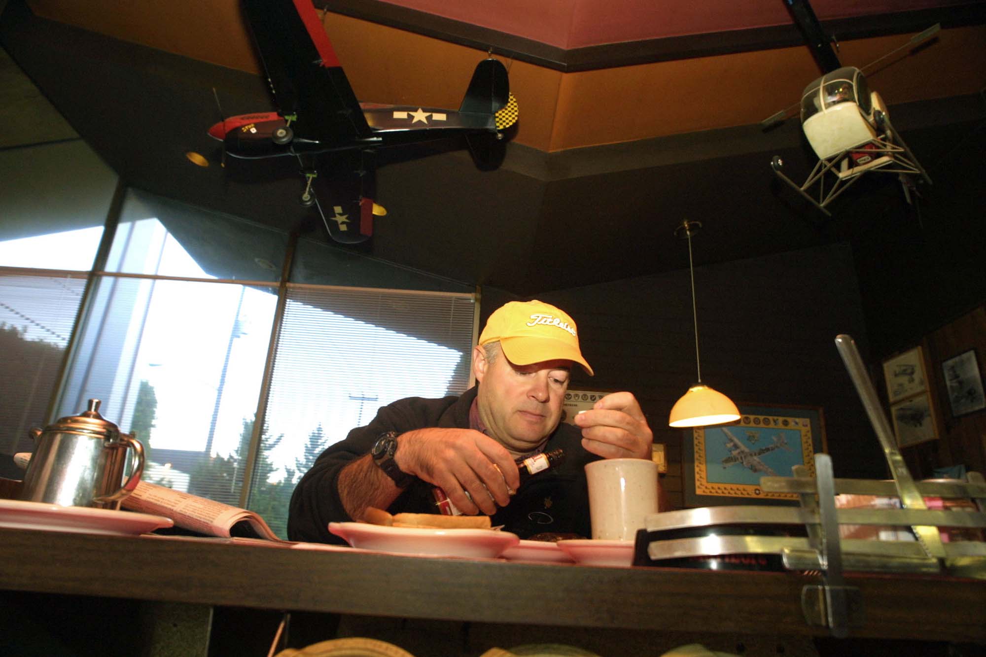 Image of Ray Brown eating breakfast at Randy's Restaurant, Tukwila, September 5, 2002