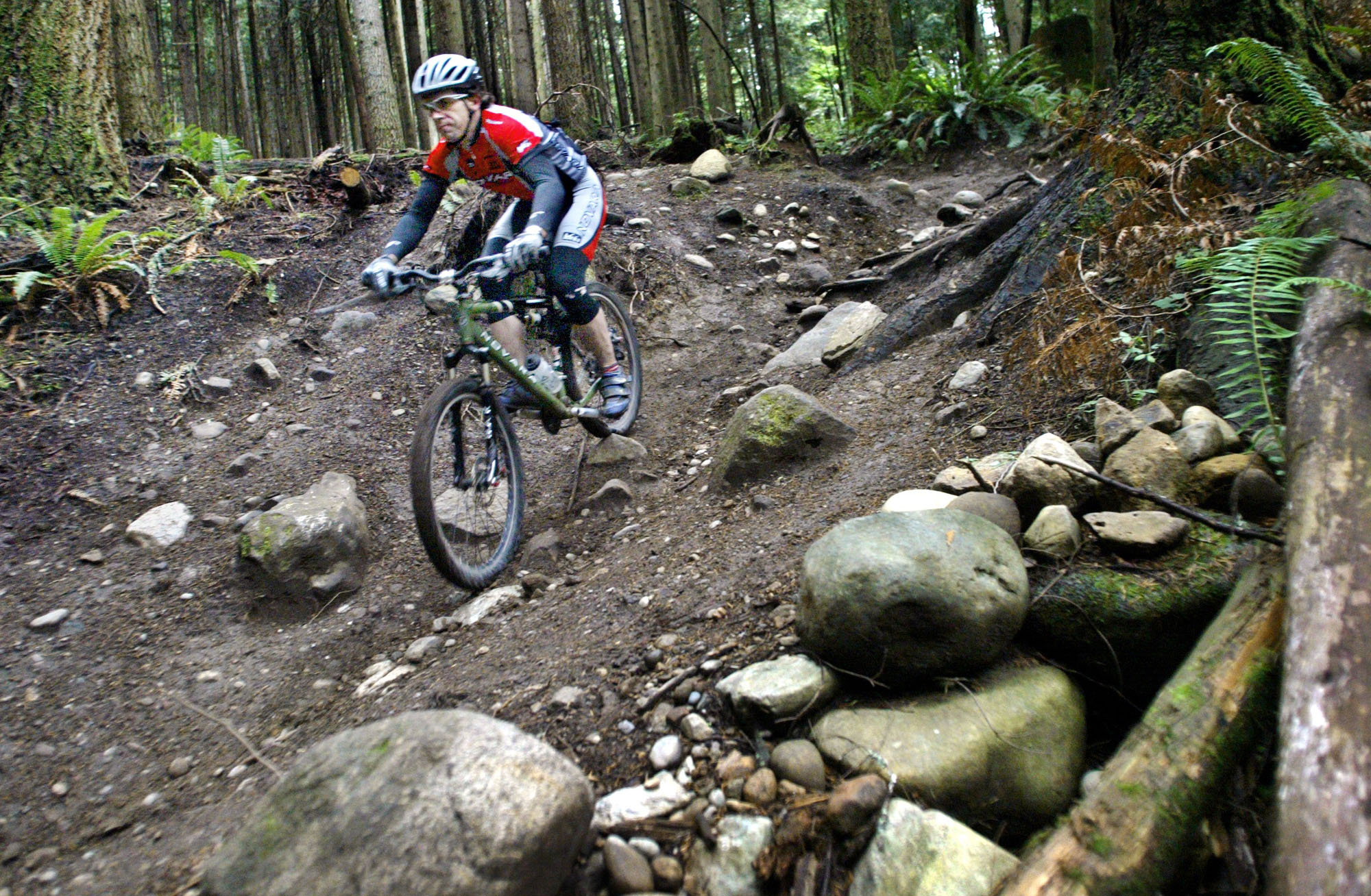 Image of Kevin Myette testing a REI mountain bike at Tiger Mountain, Issaquah, October 11, 2002