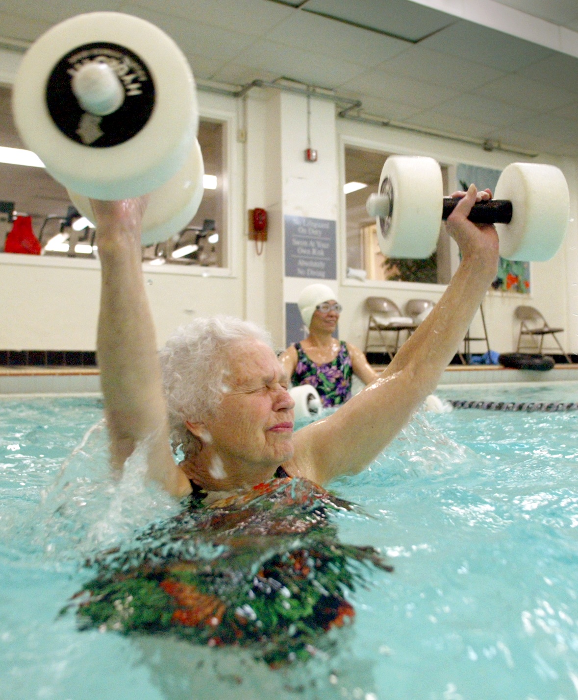 Image of Lucy Tripp participating in water aerobics class at YWCA, Seattle, December 13, 2002